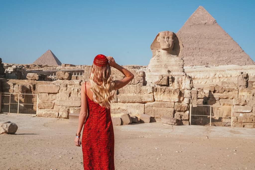 Katy Johnson at the Pyramids of Giza as a female travel blogger 